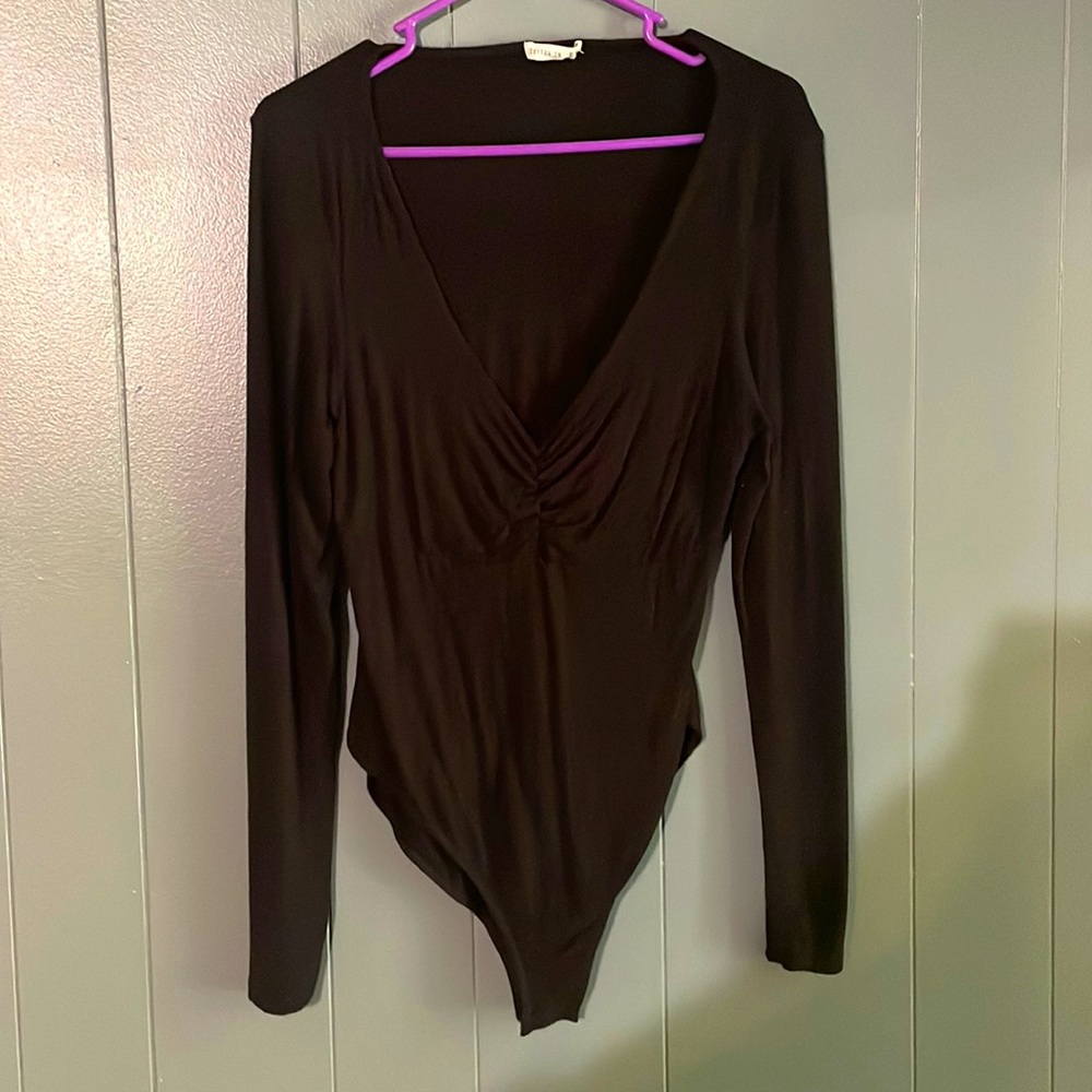 Black low neckline body suit